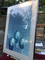 Front view of framed print showing three vases with pussy-willow stems
