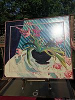 Front view of framed abstract floral print showing design and frame