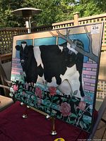 Front view of framed print on stand showing artwork detail