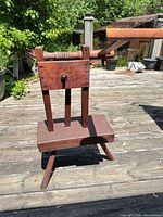 Full view of yarn winder on splayed-leg base