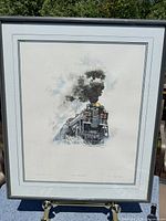 Full view of framed print on easel