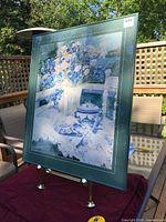 Front view of framed print on easel
