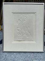 Frontal view of framed embossed print