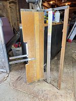 Vertical cutter folded open showing rails and measuring arms