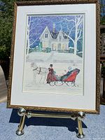 Overall view of framed print on stand