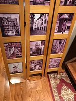 Full view of three-panel oak divider showing photo inserts