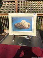 Front view of framed print showing artwork, mat, and frame