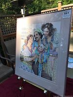 Front view of framed poster showing artwork, mat and frame