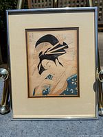 Full view of framed woodblock print with mat and frame