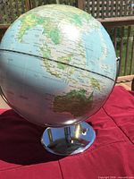 World globe on chrome stand showing Australia, Indonesia, Pacific
