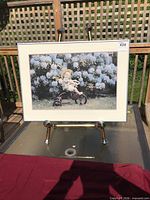 Front view of framed photographic print on easel