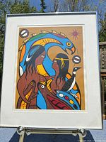 Full view of framed print on stand