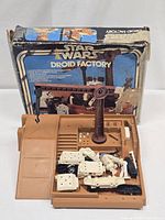 Playset base with parts and box in background