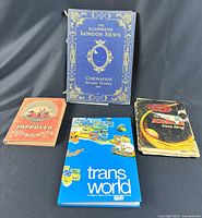 Four items front covers displayed upright and lying flat