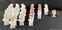 All busts arranged in rows showing quantity and variety