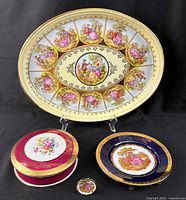 Group shot showing platter, lidded box, cobalt plate and miniature plate