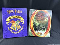 Front covers of Harry Potter and Lord of the Rings trading card binders