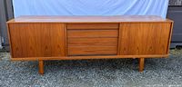 Front view of teak sideboard with drawers closed
