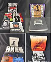 Group shot of books, CD box sets and tour programs