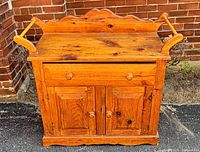Front view showing backsplash, drawer, cupboard doors