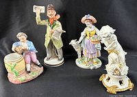 Front view showing all four porcelain figurines