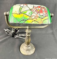 Front angled view showing shade design, base, cord