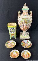 Group shot showing urn with lid, four plates, Maruhon vase