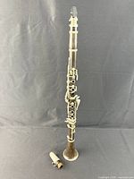 Assembled clarinet with spare mouthpiece on floor