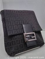 Front view of bag with flap, FF buckle, monogram fabric