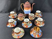 Full 17-piece moriage teaware set displayed