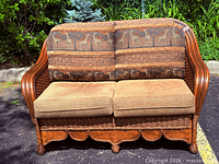 Front view of Boca Rattan wicker loveseat with cushions