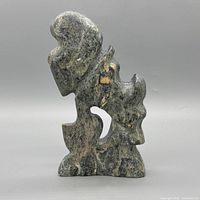Front view of abstract stone dog sculpture