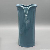 full front view of blue teal ceramic vase