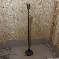 Full view of torchiere floor lamp standing upright