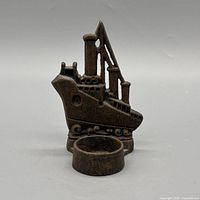 Front view showing ship design and candle cup