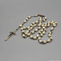 Full view of entire rosary showing beads, chain, crucifix and centerpiece