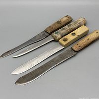All four knives showing blades and handles