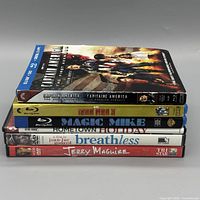 Stack of six movie cases showing spines