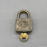 Front view of Master Lock 5024 padlock with key inserted