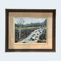 Full view of framed oil painting showing landscape with waterfall, gilt frame and linen mat