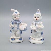 Front view of both porcelain clown figurines
