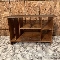 Front view showing compartments, drawer, overall structure