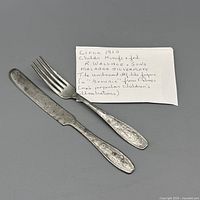 Knife and fork next to handwritten note identifying Wallace Malabar children’s flatware