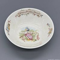 Interior view showing Jemima Puddle-Duck illustration and banner text