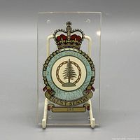Full view of acrylic plaque on stand showing entire crest and transparency
