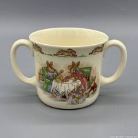 Front view showing main Bunnykins tea-table scene and both handles