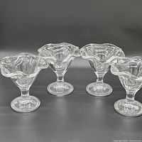 All four clear glass dessert dishes grouped
