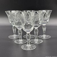 Front group view of six etched cordial glasses