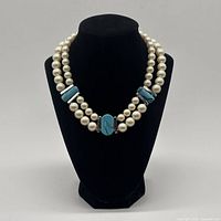 Necklace on bust showing full double strand design