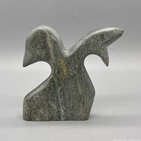 Front view of gray-green soapstone abstract sculpture